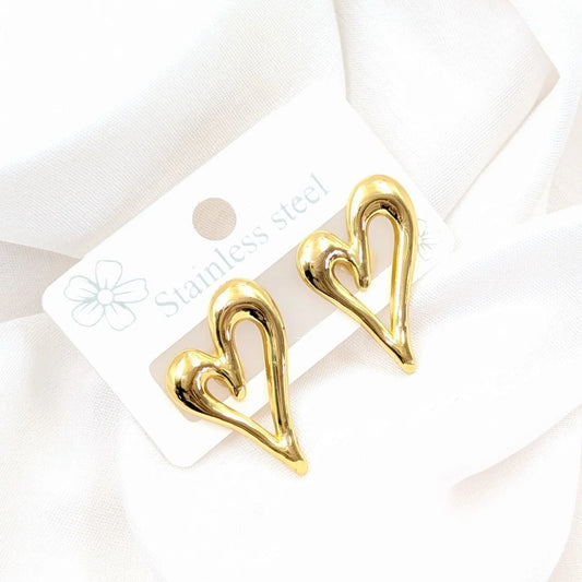 Gold heart-shaped earrings on a white card with 'Stainless Steel' text.