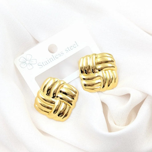 Gold knot earrings on a white card with 'Stainless Steel' text