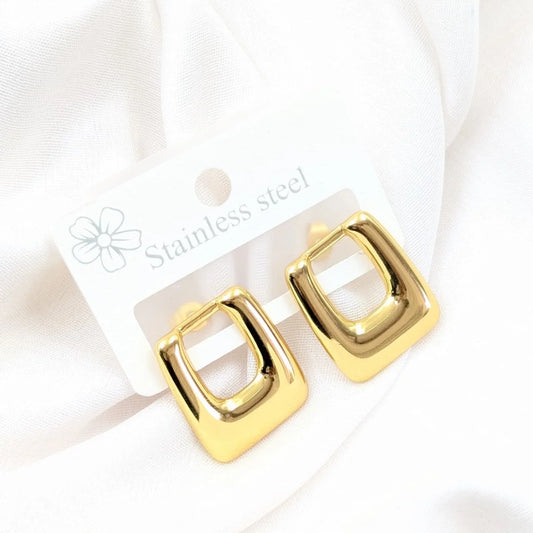 Gold square earrings on a white card with 'Stainless steel' text.